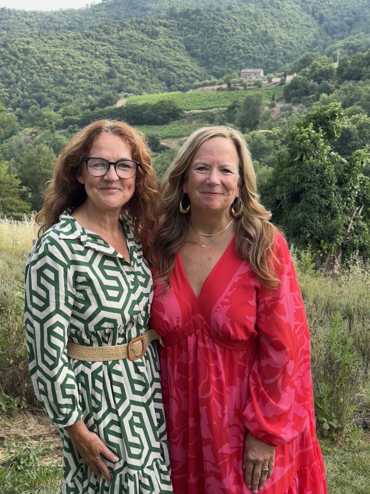 Two friends in scenic countryside